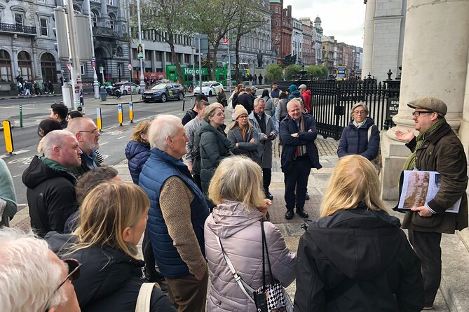 Book of Kells. Medieval Dublin Castle. 5</em> History & Heritage Tour – College Green’s Bank of Ireland: the former parliament you can still read’ /><br />
Next you step into a location that feels like a simple streetscape from a distance—until you look up. Outside on College Green, you’ll pass the <strong>Bank of Ireland</strong> building, and the guide explains that this grand facade was once the seat of the <strong>Irish Houses of Parliament</strong>.</p>
<p><p>The big details to watch for are the ones that look like decoration but actually act like history:</p>
</p>
<ul>
<li>A <strong>royal coat of arms</strong></li>
<li>Statues tied to the themes of Ireland, trade, and civic power, including <strong>Hibernia</strong> (the Latin name for Ireland) plus figures representing <strong>Fidelity and Commerce</strong></li>
<li>Ground-level features such as <strong>cannons</strong> and a <strong>sentry box</strong></li>
</ul>
<p><p>Here’s the timeline you’ll hear:</p>
</p>
<ul>
<li>For the first <strong>61 years</strong> of its life, it housed parliament</li>
<li>In <strong>1800</strong>, the Irish parliament voted itself out of existence</li>
<li>By <strong>1803</strong>, the building became the Bank of Ireland’s flagship branch</li>
</ul>
<p><p>The standout point is architectural: it was described as Europe’s first purpose-built <strong>bicameral</strong> parliamentary building, meaning it had two chambers—a House of Commons and a House of Lords.</p>
</p>
<p><p>This stop is short (around <strong>10 minutes</strong>), but it changes how you see the city. Suddenly, Dublin isn’t only churches and manuscripts. It’s also built political messaging—stone and symbolism used to project authority.</p>
</p>
<h2 id="molly-malone-statue-quick-photos-stronger-context">Molly Malone statue: quick photos, stronger context</h2>
<p><img width="669" height="446" decoding="async" src=