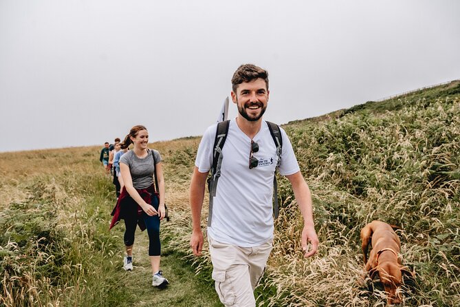 Dublin Coastal Hike with Howth Adventures - Wildflower slopes, Baily Lighthouse, and Dublin Bay from above
